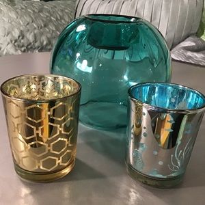 3 glass candle holders. Gold, silver and blue